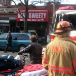 Firefighters at the scene of the fire at New Sweety nail salon on DeKalb Avenue. (Photo by Rachel Sander)