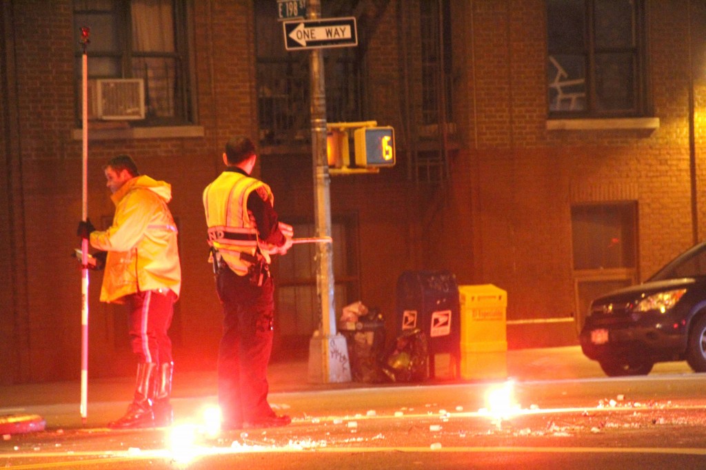 Polie investigate the scene of a car crash involving a pedestrian and alleged drunk driver. Photo by David Greene