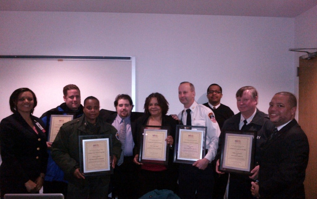 High honors went out to members of the NYPD, FDNY and Department of Sanitation for their efforts in improving the quality of life along Wakefield’s bustling commercial spur.  They were honored Friday, Jan. 31 by the Mosholu Preservation Corporation and East 233rd Street/White Plains Road Merchants Association, thanking the agencies for promoting safety and cleanliness along the commercial spur while forging team efforts.  Holding up awards are members of the NYPD, FDNY, DSNY and EMS. Photo courtesy Mosholu Preservation Corporation