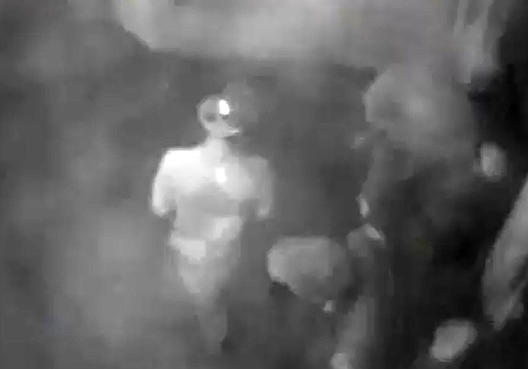 BLURRY SURVEILLANCE VIDEO still photo shows three men approaching a man sleeping by St. Tolentine Church. Two would later be charged with his death. Video still photo courtesy NYPD