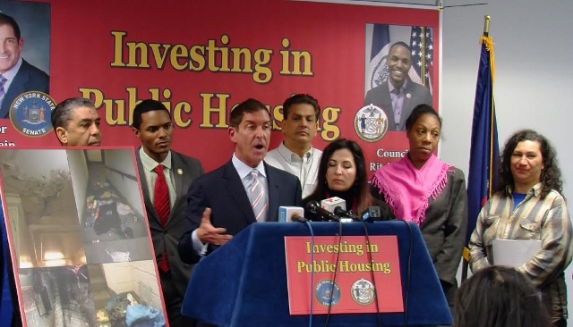 SEN. JEFF KLEIN (at podium) outlines conditions in public housing that were published in a report his office and Councilman Ritchie Torres (behind podium) drafted. Photo by Rose Itzcovitz