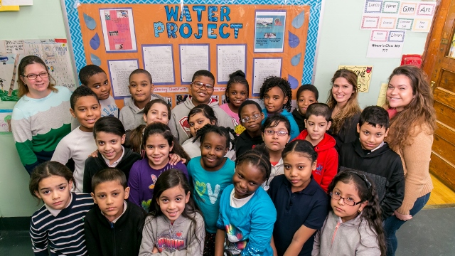 THIS CLASS OF third graders at PS 94 Kings College School learned about the importance of funneling drinking water to Kenya through a January writing project. Teacher Nicole Zippo is in the back row (2nd from right), and assistant teacher Maggie Stallone is at far left. Photo by Adi Talwar