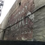 THE HISTORICAL AD on the side of this building at 383 E. 201st St. (pictured) reads “Vote Henry Bruckn.” Photo by Angel Mindanao