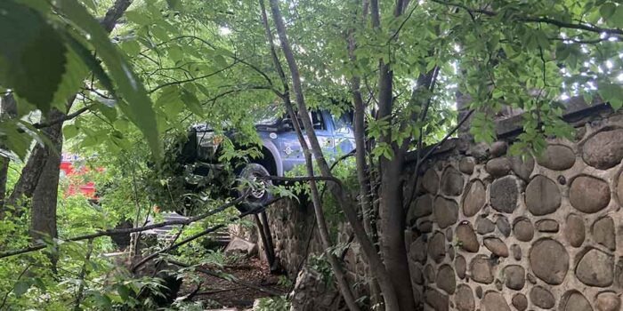 Bedford Park: One Arrested, One Injured in Crash as Truck Hangs Over Mosholu Parkway Wall